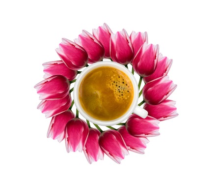 Cup of coffee with pink tulip flower buds. Flat lay, top viewの写真素材