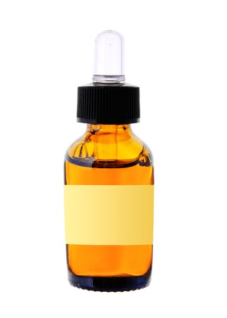 bottle with essence oil isolated on whiteの写真素材