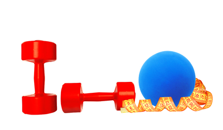 Red dumbbells fitness, measure tape and blue ball isolated on whiteの写真素材