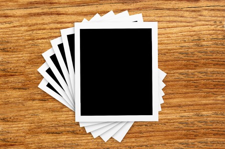 Film Vintage empty photo cards on wood backgroundの写真素材