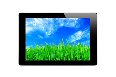 Black Touch Screen Tablet, blue sky and green grass isolated on white backgroundの写真素材