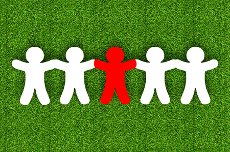 Paper team white people over grass backgroundの写真素材