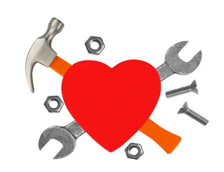 Heart and tools. Concept: Renovation of heart. Isolated on whiteの写真素材