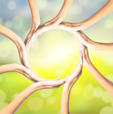 Human hands making circle on bright backgroundの写真素材