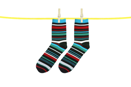 Striped socks hanging isolated on whiteの写真素材
