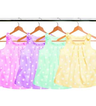 Different clothes on hangers isolated on white backgroundの写真素材