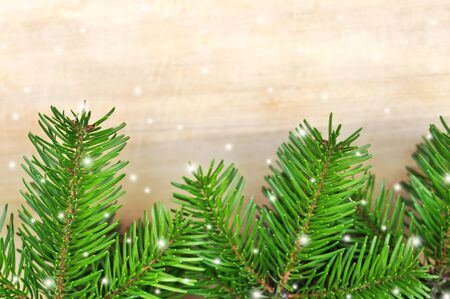 green christmas tree on wood table background as holiday decorの写真素材