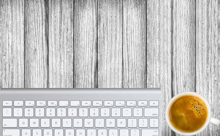 Office workplace with cup and keyboard . Top viewの写真素材