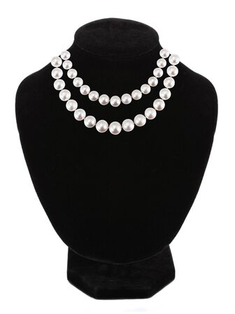 Pendant with gem stones pearls on black mannequin isolated on whiteの写真素材
