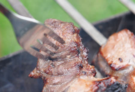 Barbecue grill meat, close-up, man cook outdoorの写真素材