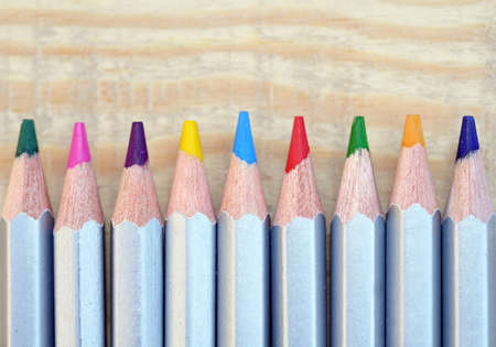 color pencils on wooden table backgroundの写真素材