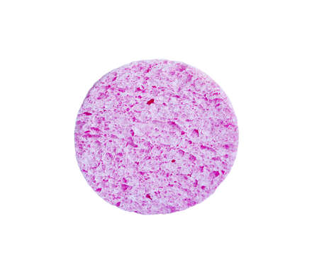 Pink cosmetic sponge for face washing isolated on whiteの写真素材
