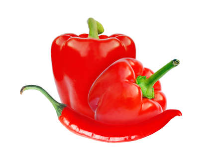 Red sweet paprika and hot chilly peppers composition isolated on white for design packagingの写真素材