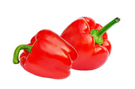 Two red sweet paprika peppers isolated on white for design packagingの写真素材