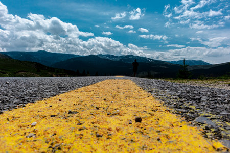 Asphalt road in the mountains with blue sky.の写真素材