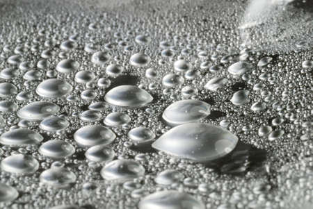 metalic colored water drops close upの写真素材