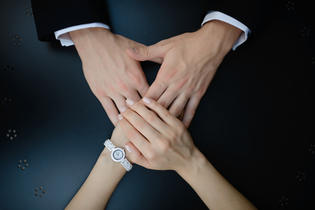 Seniors hold hands on beachの写真素材