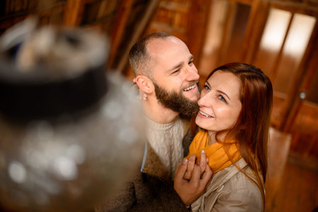 Close up portrait of happy smiling couple in love, guy kissing his girlfriend.の写真素材