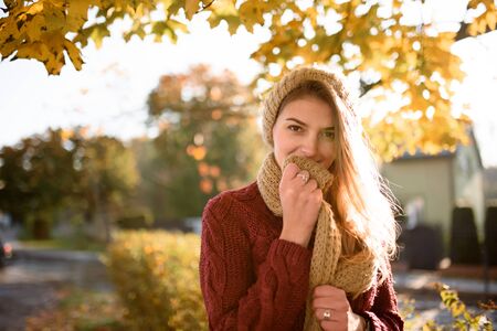 Portrait of a beautiful autumn woman. Girl posing to the camera.の写真素材