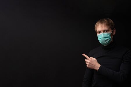 A masked man points to your test.の写真素材