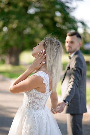 The groom dances his bride around the brideの写真素材