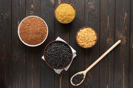 Fresh organic natural beans on wooden rustic black background
