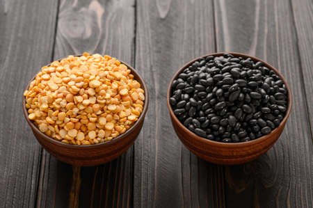 Fresh organic natural beans on wooden rustic black backgroundの写真素材