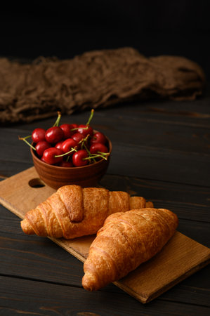 Sweet fresh cherry on a dark wooden background.の写真素材