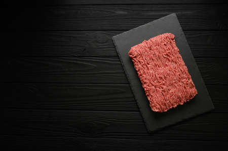 Raw mince beef, ground meat. Black background. top view. copy spaceの写真素材