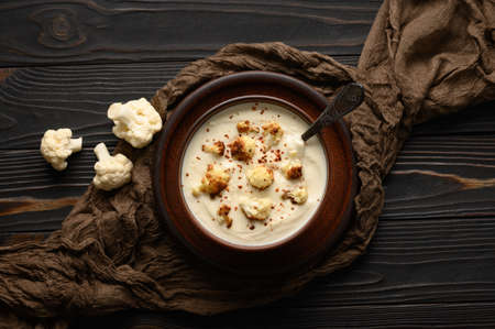 Creamy cauliflower soup with fried cauliflower and croutons.の写真素材