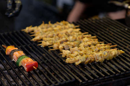 Octopus skewers at a street food festival.の写真素材