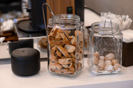 Cookies in glass jars for sale in a cafe.の写真素材