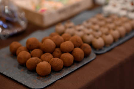 A set of dark chocolate candies for sale.の写真素材