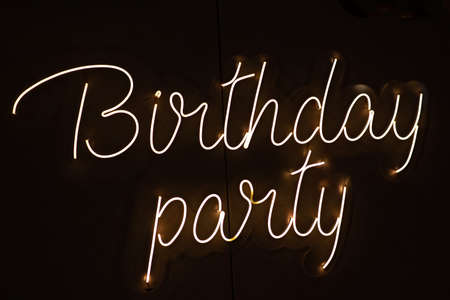 Birthday party neon sign. Glowing neon lettering Birthday templateの写真素材