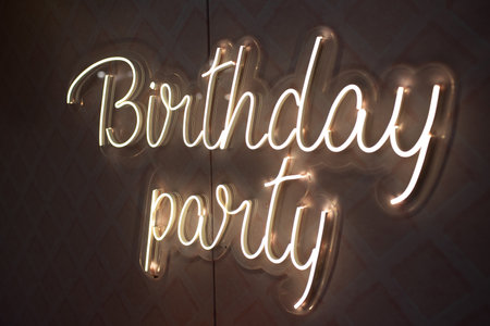 Birthday party neon sign. Glowing neon lettering Birthday templateの写真素材