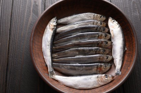 Fresh herring on rustic wooden background, close up shotの写真素材