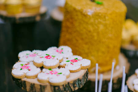cakes on a wooden table for a wedding candy barの写真素材
