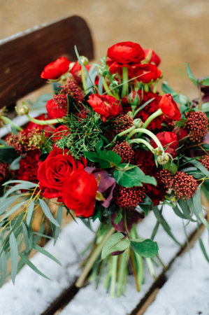 Winter wedding bouquet of red rosesの写真素材