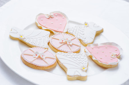 many pink cookies on a white plateの写真素材