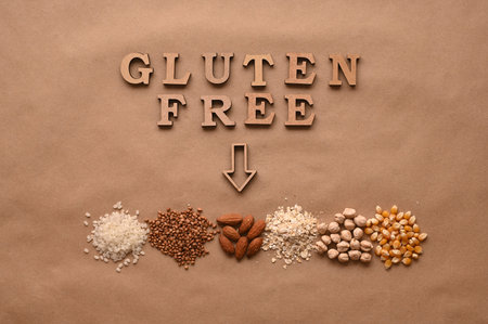 Gluten free text and gluten free products on brown background.