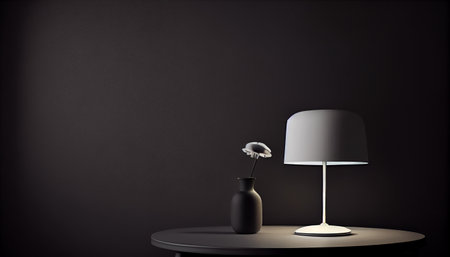 Beautiful minimalistic presentation background with a table and a white lamp against a black textured wallの素材