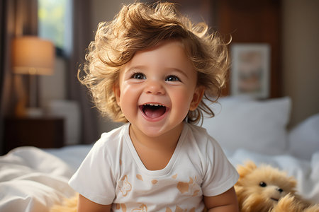 Cute sweet toddler child, tickling feet on the bed, laughing and smiling,の素材