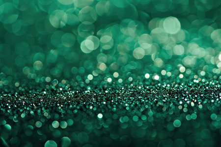 Abstract shiny green glitter background. Emerald green glitter wide horizontal backgroundの素材