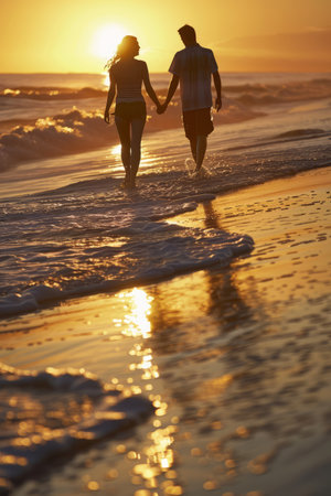 a couple enjoying a sunset walk on the beach, with gentle waves and scenic views, highlighting romance and leisure.の素材