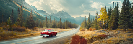 a scenic road trip through the mountains with a vintage car and breathtaking viewsの素材