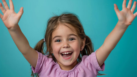 a Caucasian girl showing joy on a studio backgroundの素材