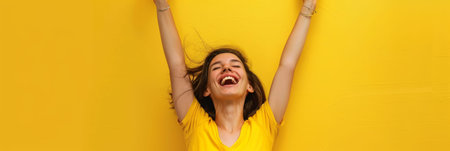 a Caucasian woman showing joy on a studio backgroundの素材