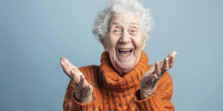 a Caucasian elderly person with a cheerful expression on a studio backgroundの素材
