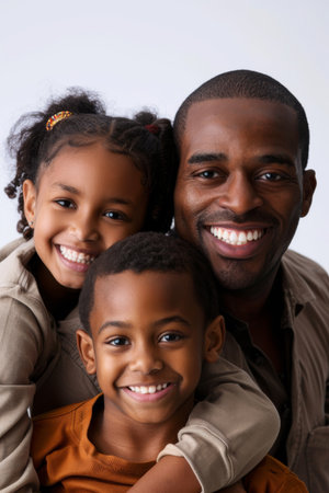 an African American family looking playful on a studio backgroundの素材