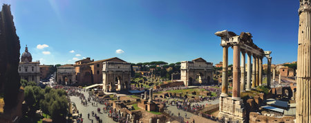 An ancient Roman forum with stone arches and bustling crowds.の素材